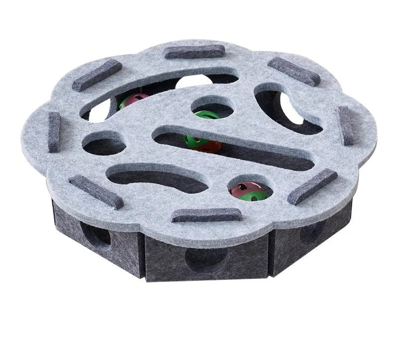 Gray round felt puzzle treat toy with a holed top, seen from above