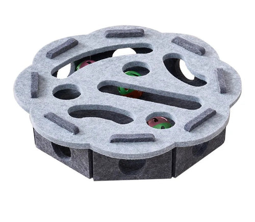 Gray round felt puzzle treat toy with a holed top, seen from above