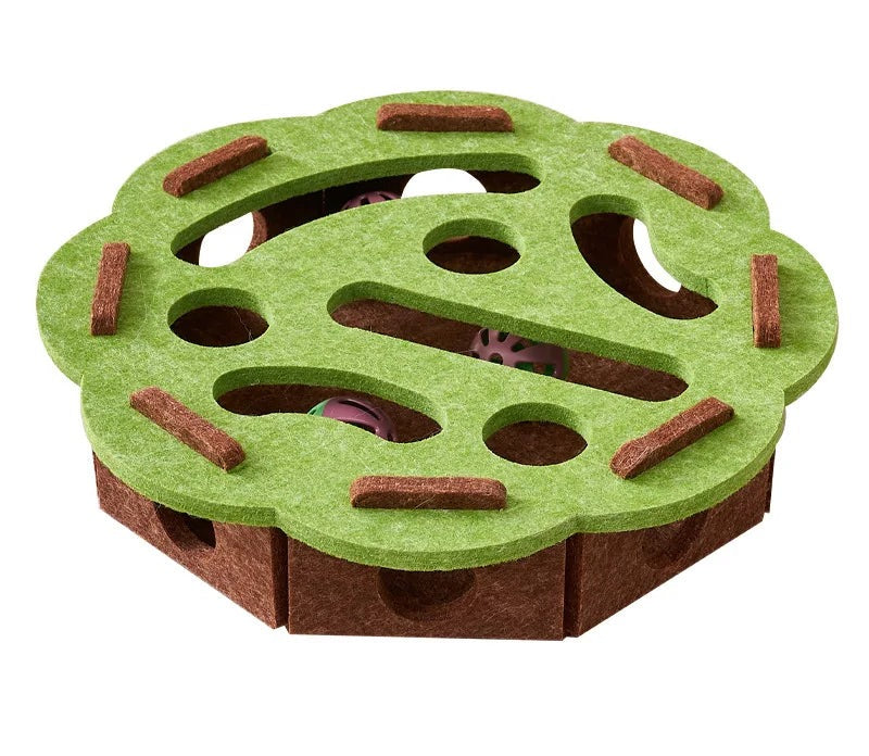 Green round felt puzzle treat toy with a holed top, seen from above