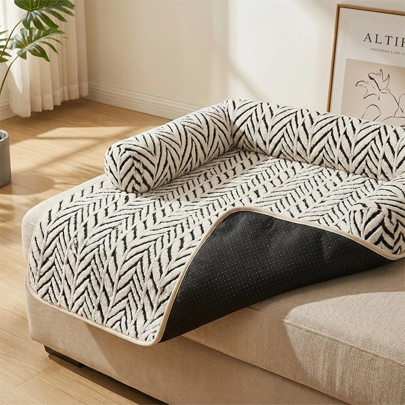 Corner of the Cozy Sofa Mat lifted to show the grippy black underside