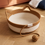 Brown Purrloom Curl Basket on a wood floor